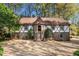 Charming Tudor-style home with a unique turret entrance, complemented by a spacious driveway at 3186 Sugarplum Ne Rd, Atlanta, GA 30345