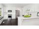 Modern white kitchen with stainless steel appliances, quartz countertops, and cozy window seating at 3186 Sugarplum Ne Rd, Atlanta, GA 30345