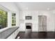 Sunlit kitchen features stainless appliances, white cabinets, breakfast bar and window seat at 3186 Sugarplum Ne Rd, Atlanta, GA 30345