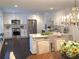 Bright, spacious kitchen featuring white cabinets, stainless steel appliances, and a marble countertop island at 3186 Sugarplum Ne Rd, Atlanta, GA 30345