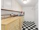 Clean and functional laundry room, vintage washer-dryer and checkerboard floor at 3186 Sugarplum Ne Rd, Atlanta, GA 30345