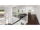 Second floor view of living room with vaulted ceiling, fireplace, and elegant chandelier at 3186 Sugarplum Ne Rd, Atlanta, GA 30345