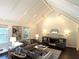 Cozy living room with vaulted ceiling, fireplace, and neutral-toned furnishings at 3186 Sugarplum Ne Rd, Atlanta, GA 30345