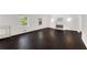 Spacious living room features dark hardwood floors and a cozy fireplace at 3186 Sugarplum Ne Rd, Atlanta, GA 30345
