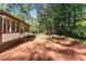 Brick patio extends from the house into a lush backyard, enhanced by garden views at 3186 Sugarplum Ne Rd, Atlanta, GA 30345