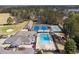 Aerial view of community pool, tennis courts, golf course, and community center at 404 Willow Way, Villa Rica, GA 30180
