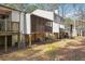 Exterior view of a home with a screened deck and backyard at 404 Willow Way, Villa Rica, GA 30180