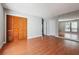 Spacious bedroom featuring wood floors, closets, and a window at 404 Willow Way, Villa Rica, GA 30180
