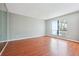 Large bedroom with hardwood floors and a bright window at 404 Willow Way, Villa Rica, GA 30180