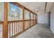 A spacious screened in deck with natural wood beams and fan at 404 Willow Way, Villa Rica, GA 30180