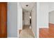 Hallway with neutral colors, tile flooring, washer and dryer hook ups at 404 Willow Way, Villa Rica, GA 30180
