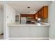 Efficient kitchen with white appliances and a breakfast bar at 404 Willow Way, Villa Rica, GA 30180