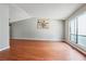 Spacious living area with hardwood floors, a large window, and a decorative painting at 404 Willow Way, Villa Rica, GA 30180