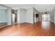 Expansive living area with wood floors, access to a balcony, and neutral paint at 404 Willow Way, Villa Rica, GA 30180