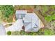 Overhead view of home with a large roof, mature landscaping, and a driveway with ample parking at 460 Laurel Chase Ct, Atlanta, GA 30327