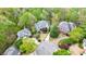 Stunning aerial view of beautiful homes nestled amongst lush green trees in a desirable neighborhood at 460 Laurel Chase Ct, Atlanta, GA 30327