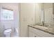 Bathroom with granite countertop, white subway tile, and modern fixtures at 460 Laurel Chase Ct, Atlanta, GA 30327