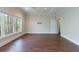 Bedroom features hardwood floors, large window, and ceiling fan at 460 Laurel Chase Ct, Atlanta, GA 30327