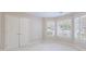 Bedroom with bay window, plush carpeting, and double door closet at 460 Laurel Chase Ct, Atlanta, GA 30327