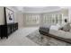 Main bedroom features a tray ceiling, oversized windows, and custom shutters at 460 Laurel Chase Ct, Atlanta, GA 30327