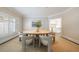 Elegant dining room featuring a round table, neutral chairs, and an abundance of natural light at 460 Laurel Chase Ct, Atlanta, GA 30327