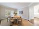 Charming dining room featuring a round table, neutral chairs, and an abundance of natural light at 460 Laurel Chase Ct, Atlanta, GA 30327