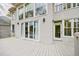 Back exterior elevation featuring multiple windows and a large deck at 460 Laurel Chase Ct, Atlanta, GA 30327