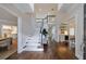 Grand foyer with a soaring staircase, hardwood floors, and views of the dining and living spaces at 460 Laurel Chase Ct, Atlanta, GA 30327