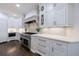 Stylish kitchen featuring custom cabinets, stainless steel range, and sleek countertops at 460 Laurel Chase Ct, Atlanta, GA 30327