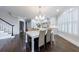 Eat-in kitchen boasts natural light, custom cabinets, and easy access to stairs and hallway at 460 Laurel Chase Ct, Atlanta, GA 30327