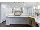 Spacious kitchen features white cabinets, modern appliances, and a breakfast nook at 460 Laurel Chase Ct, Atlanta, GA 30327
