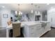 Open kitchen with an eat-in island, stainless steel appliances, and a view of the living area at 460 Laurel Chase Ct, Atlanta, GA 30327