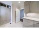 Kitchen area features custom cabinets and drawers for storage, marble countertops, and tiled floor at 460 Laurel Chase Ct, Atlanta, GA 30327