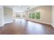 Spacious living room with hardwood floors and bright, window-lit view at 460 Laurel Chase Ct, Atlanta, GA 30327