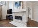Living room featuring a stone fireplace and entertainment center at 460 Laurel Chase Ct, Atlanta, GA 30327