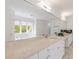 Beautiful main bathroom features an extended vanity with dual sinks, stylish faucets, and natural light at 460 Laurel Chase Ct, Atlanta, GA 30327