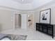 Spacious main bedroom suite features neutral colors, tray ceiling, and a convenient en-suite bathroom at 460 Laurel Chase Ct, Atlanta, GA 30327