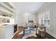 Cozy sitting area with custom built-in shelving, a wet bar, and comfortable seating at 460 Laurel Chase Ct, Atlanta, GA 30327