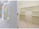 Bright walk-in closet with ample shelving and space; customize to fit all your storage needs at 460 Laurel Chase Ct, Atlanta, GA 30327