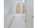 Spacious walk-in closet with custom shelving and a dressing mirror creates optimal organization at 460 Laurel Chase Ct, Atlanta, GA 30327