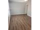 Bedroom with vinyl floors, ceiling fan, and neutral gray paint at 5331 Ridge Forest Dr, Stone Mountain, GA 30083