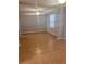 Spacious living room with tile floors, ceiling fan, and neutral gray paint at 5331 Ridge Forest Dr, Stone Mountain, GA 30083