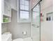 Bright bathroom with a glass door shower and white tile at 733 Frederica Ne St # 12, Atlanta, GA 30306