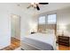 Bright bedroom featuring hardwood floors, a ceiling fan, and natural light from the windows at 733 Frederica Ne St # 12, Atlanta, GA 30306