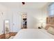 Bright bedroom featuring hardwood floors, a ceiling fan, and a full length mirror at 733 Frederica Ne St # 12, Atlanta, GA 30306
