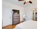 Bright bedroom featuring hardwood floors, a ceiling fan, and a view of the kitchen at 733 Frederica Ne St # 12, Atlanta, GA 30306
