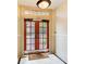 Interior view of the front door with a welcome mat and sidelight providing natural lighting at 733 Frederica Ne St # 12, Atlanta, GA 30306