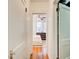 Hallway view into a bedroom showcasing hardwood floors and a neutral color scheme at 733 Frederica Ne St # 12, Atlanta, GA 30306