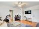 The living room with hardwood floors includes a home office setup and a television at 733 Frederica Ne St # 12, Atlanta, GA 30306