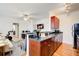 A living room next to the kitchen features hardwood floors and neutral-toned furniture at 733 Frederica Ne St # 12, Atlanta, GA 30306